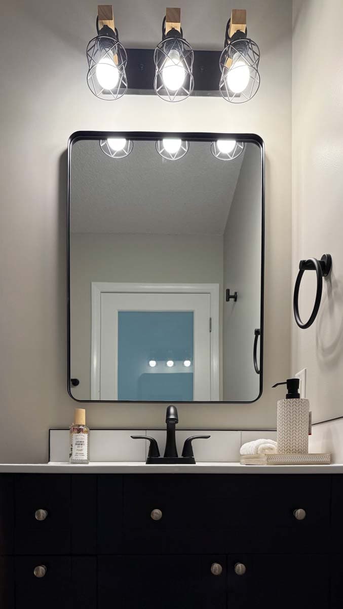 Black Vanity & Cage Lights — Bathroom Remodel by Inside The House Calgary